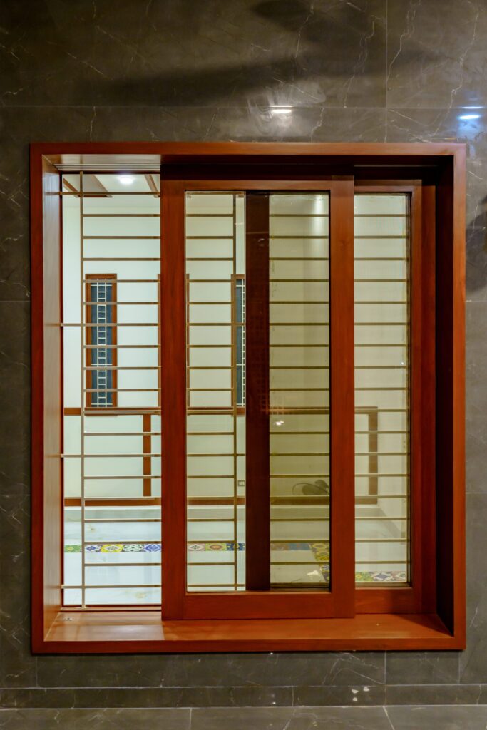 Nilambur teak wood sliding windows